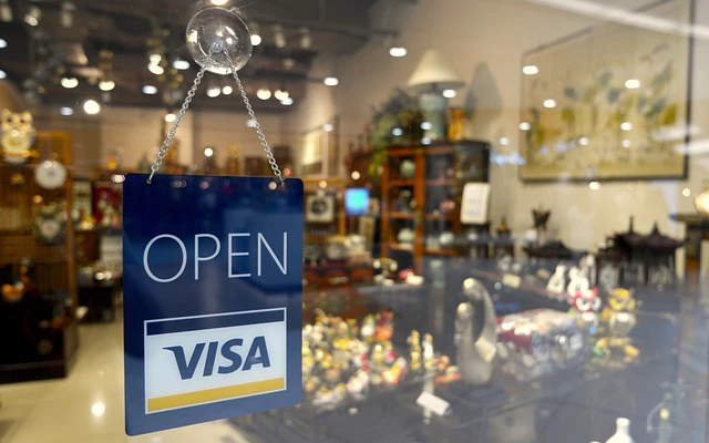 View through a shop window with an open sign